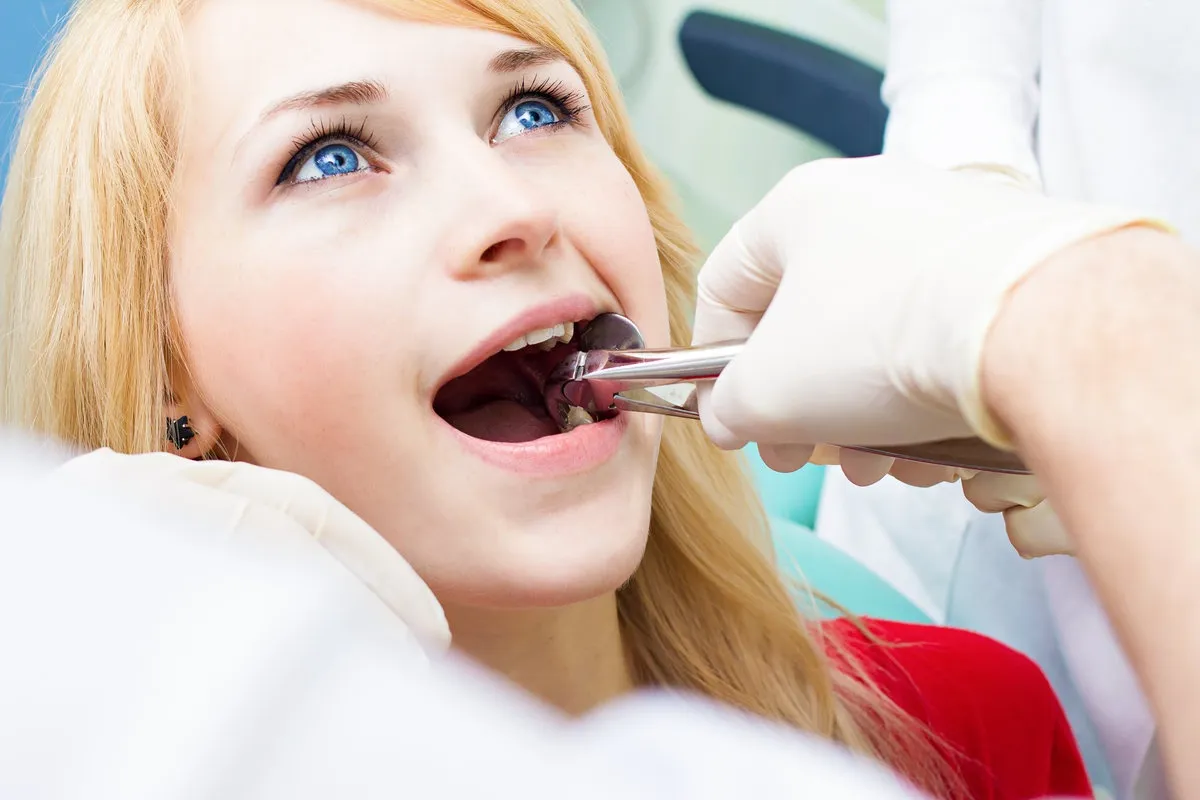 Happy couple smiling outdoors - Sunrise Dental Arts Care Wisdom tooth removal
