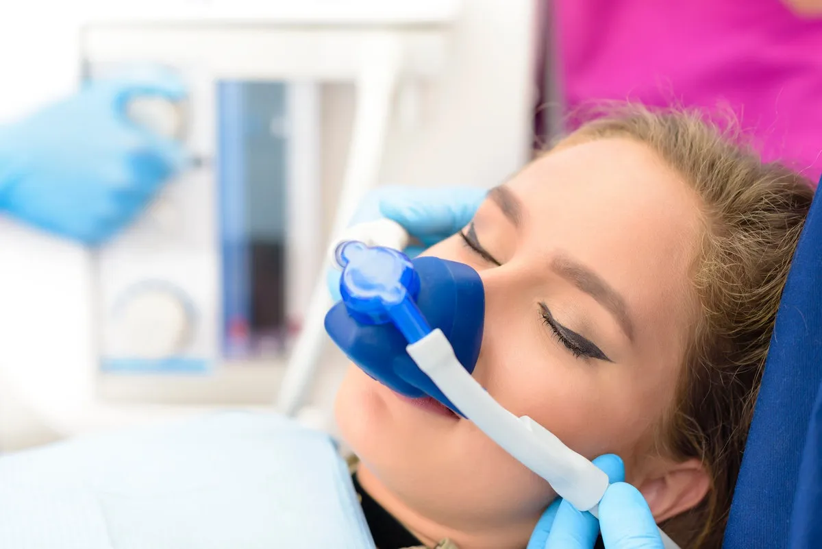 Happy couple smiling outdoors - Sunrise Dental Arts Care Inhalation Sedation at Clinic