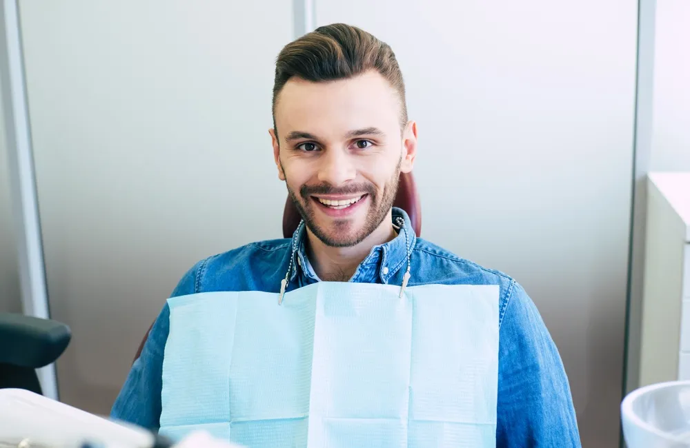 Man at the dentist for a check up - Dental Implants in Hillcrest