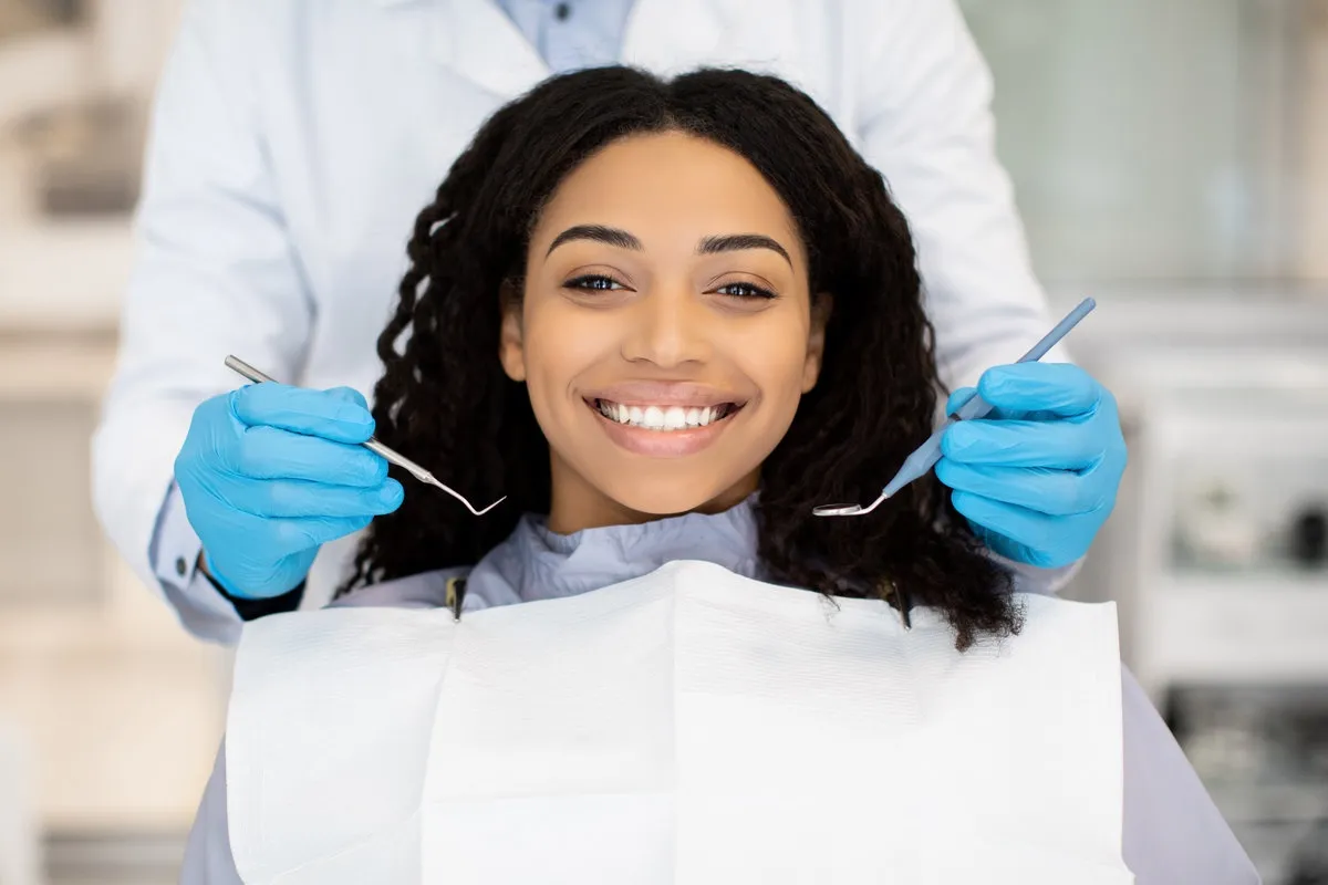 Happy couple smiling outdoors - Sunrise Dental Arts Care Portrait Of Happy Young Black Woman Having Check Up At Dental Clinic