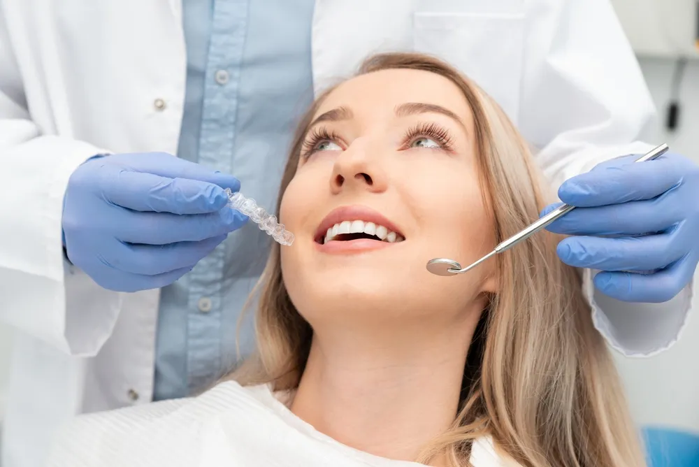 Woman having her teeth examined by a dentist before a whitening procedure