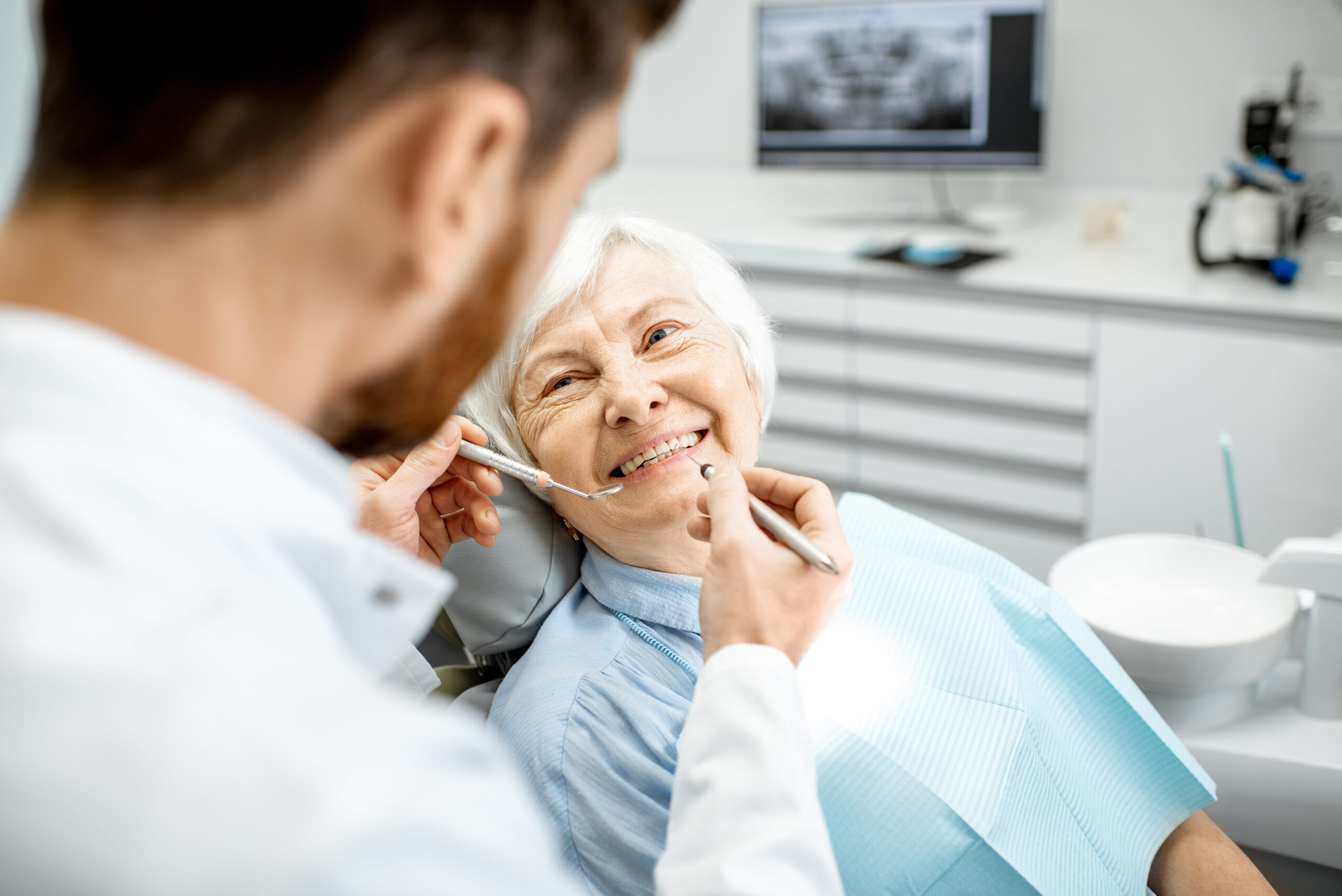 Happy couple smiling outdoors - Sunrise Dental Arts Care